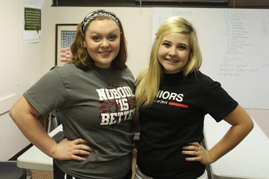 Junior Trystan Knapp and senior Abby Garrett proudly wear their class shirts on class color day.