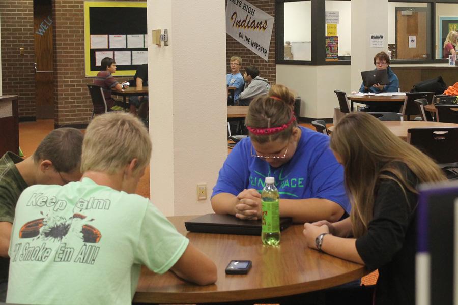 Students hold before school bible study