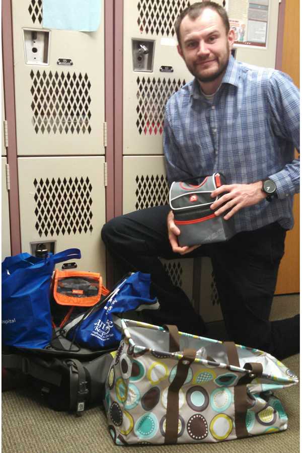 Joshua Tanguay collects luggage items.