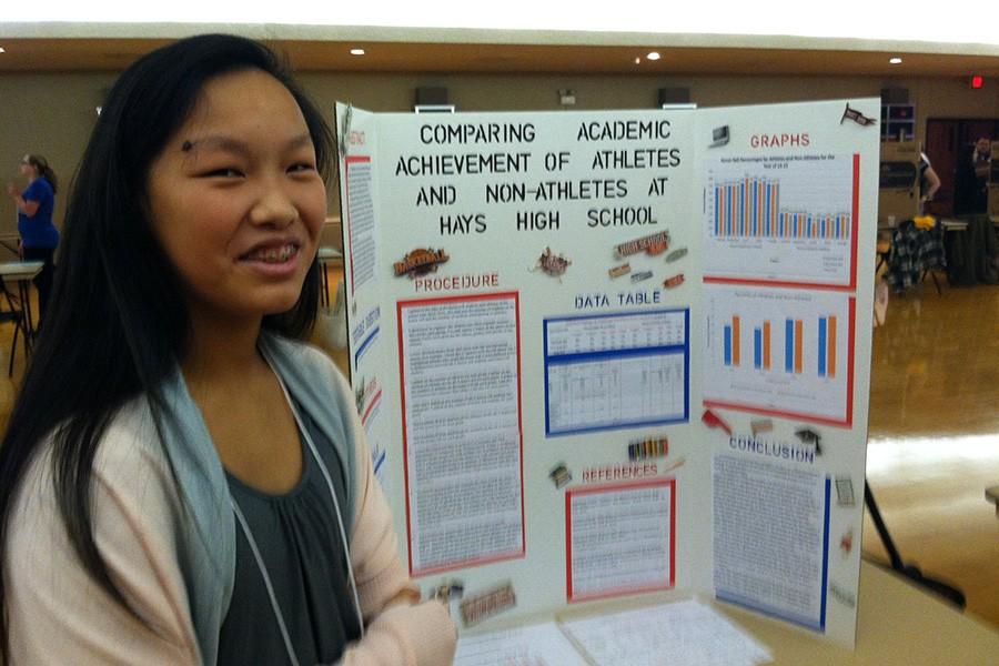 Freshman Cori Isbell presents her science fair project which compared the academic achievements of athletes to those of non-athletes. 