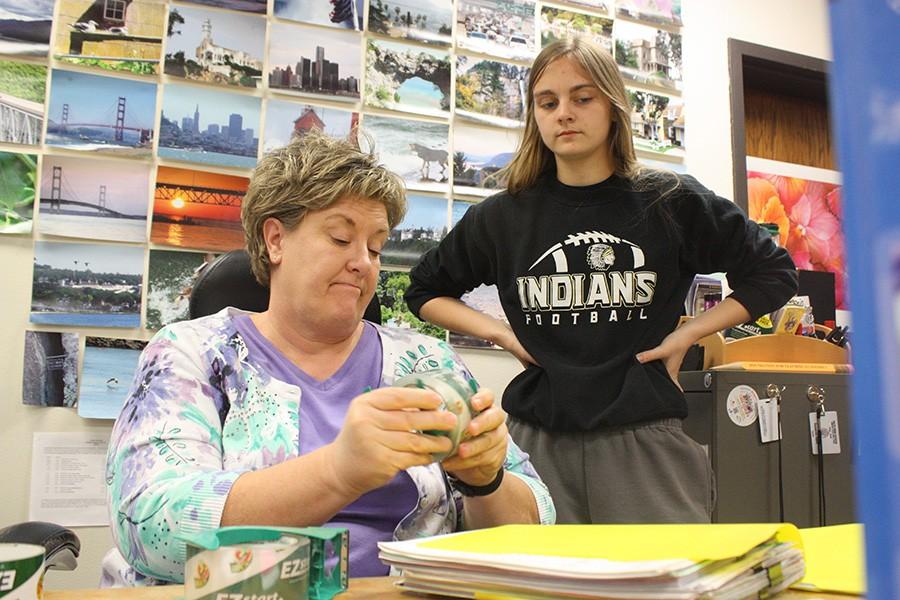 Project Management instructor Suzanne Stark discusses a project with junior Alyssa Bryant.