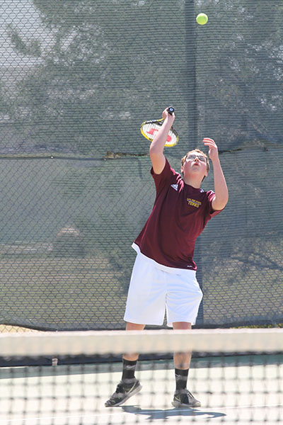 Boys tennis competes at home