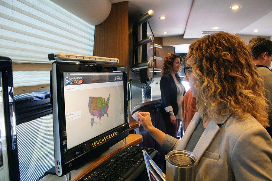 AP Government instructor Abby Maska gets involved with the interactive screens in the C-SPAN bus.