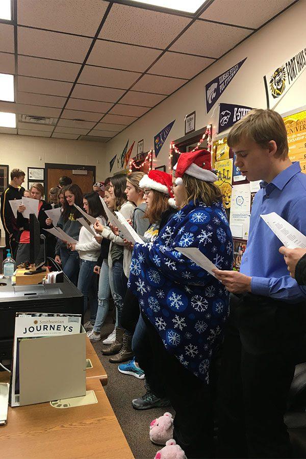 Lora Gallegos-Hayness Spanish II class carols in the counseling office.
