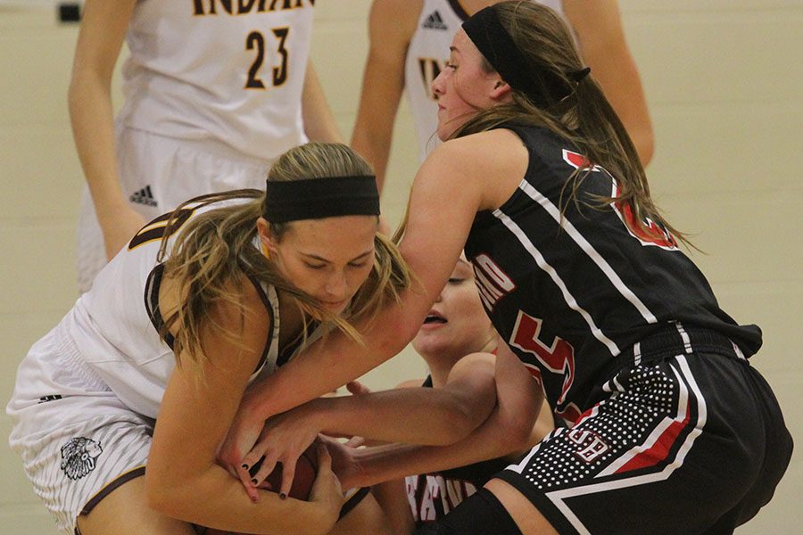 Junior Macey Steckel fights a player from the Great Bend Panthers for the ball during a recent game at the Hays City Shootout. On Dec. 6, Lady Indians faced the Greenbacks and came away with a 53-33 victory. 