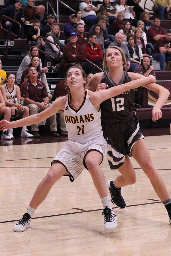 During+the+Lady+Indian+basketball+game+against+Garden+City+on+Dec.+1%2C+sophomore+Savannah+Schneider+blocks+out+for+a+rebound.+