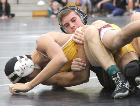 Wrestling competes at home