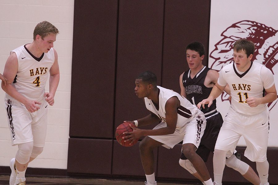 Senior Claiborne Kyles guards the ball after getting a rebound.
