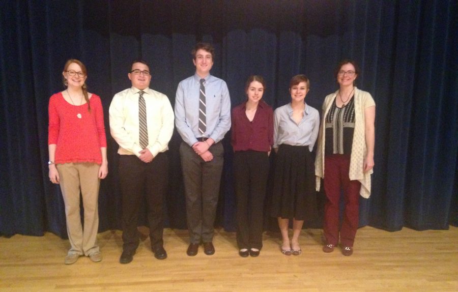 Coach Vera Haynes, seniors Adam OConnor, Griffin Lowry, junior Madison Karlin, senior Hannah Norris, and Coach Codi Fenwick stand together for a photo at the State Debate Tournament.