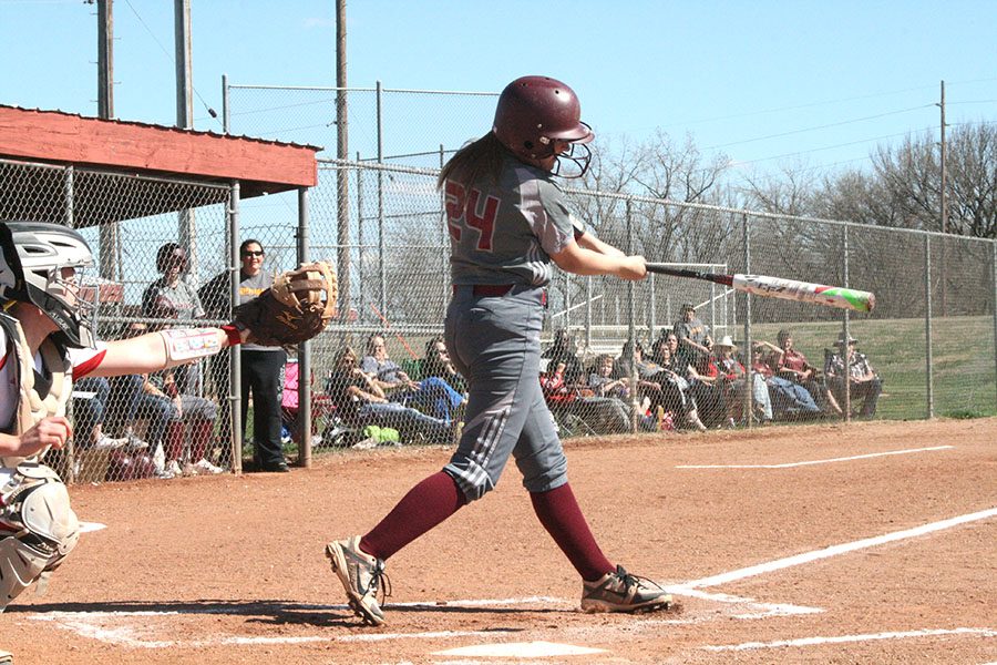 Senior Cameron Jensen swings through at a home game against the Red Demons on April 6. 