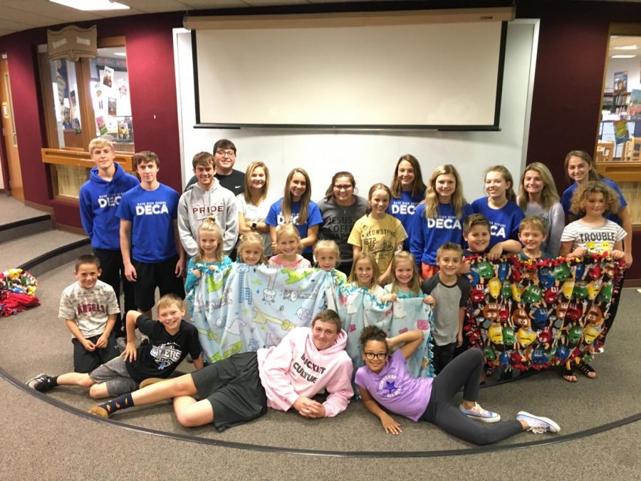 DECA worked with children from Wilson Elementary to make blankets to donate to the Ronald McDonald Houses Charity.