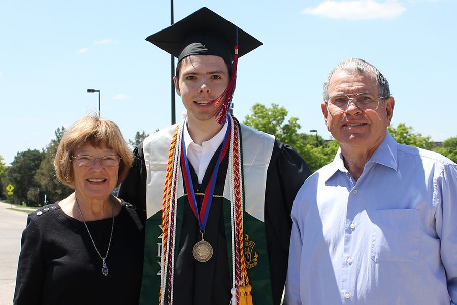 Christopher Rooney poses for a photo after his graduation at KU. He is joined in this photo by his grandparents Noel and Sharon Rooney. Christopher graduated from KU with a Bachelors in Astronomy and Physics.