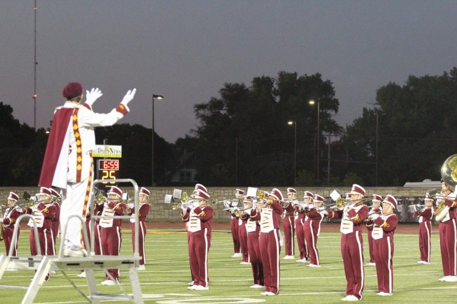 The Marching Indians perform their halftime show at a home football game against Liberal. 