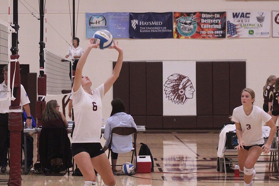 Senior Hannah McGuire setting the ball at a home game last year. McGuire had 38 total assists at her recent game. 