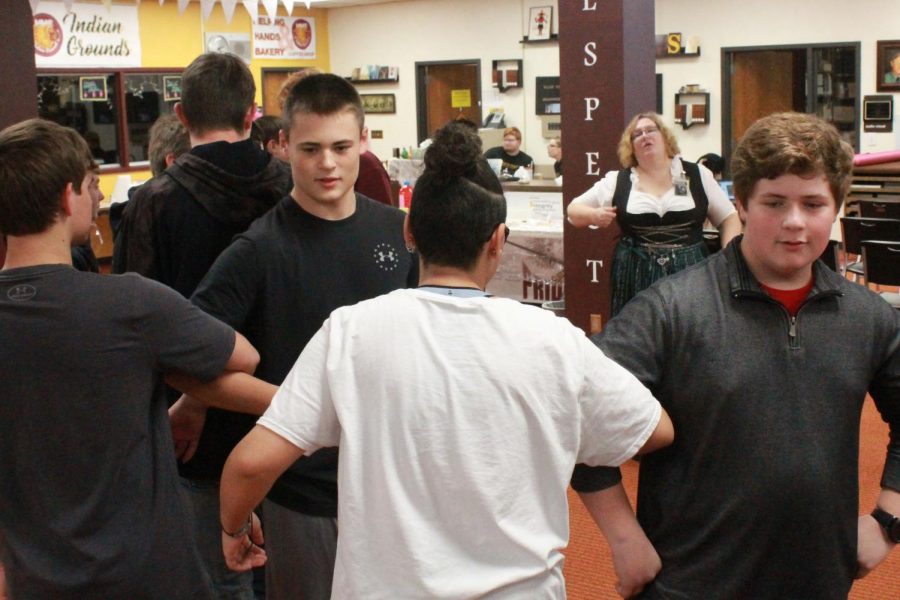 Freshmen Kaden Herreman and Jackson Reed participate in the Grosser Atlantik dance in their M4 German I class. Both German classes had the opportunity to learn more about the German culture through this Oktoberfest activity.