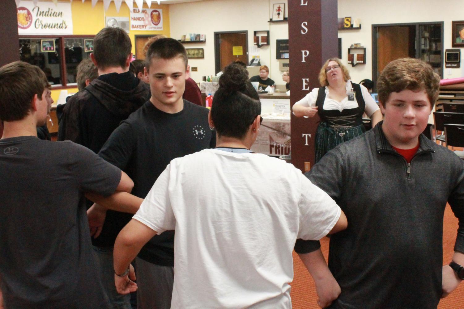 Freshmen Kaden Herreman and Jackson Reed participate in the Grosser Atlantik dance in their M4 German I class. Both German classes had the opportunity to learn more about the German culture through this