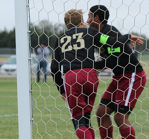 Seniors Trey McCrae and Jacob celebrate together after McCrae ties the game up 3-3 against the Liberal Redskins.