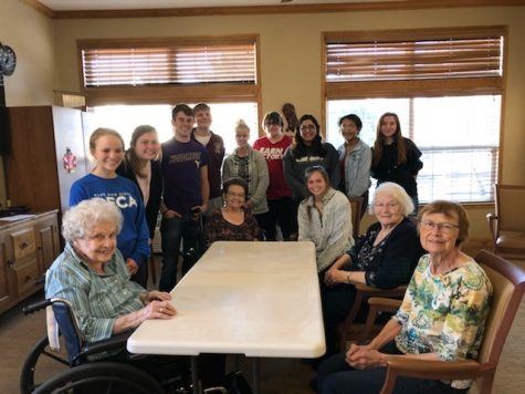 DECA visits senior center for help with service project