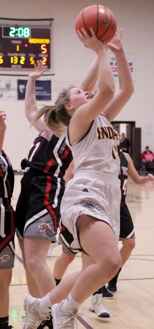 Senior Mattie Hutchinson goes up for a lay-up at the Hays City Shootout against Great Bend.