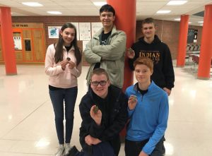 The Scholars Bowl team poses with their medals. They were undefeated and came home with a first place win.