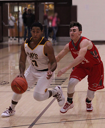 Senior Trey McCrae beats Great Bend defender off the dribble, taking him to the basket.