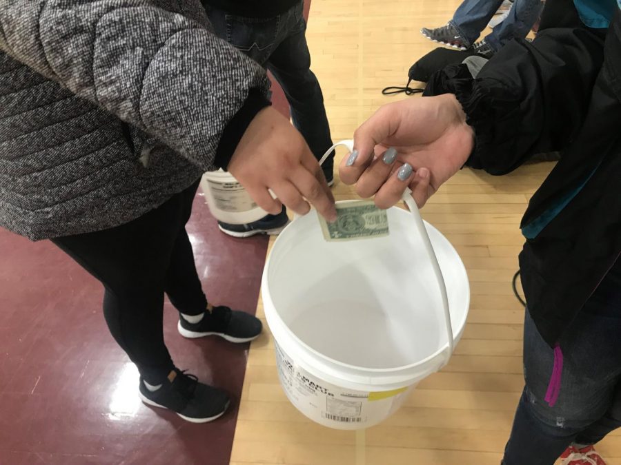 DECA seniors Isabelle Braun and Kallie Leiker made an effort to wrap up their Ronald McDonald House project with a final Miracle Minute, raising a total of $4.76.