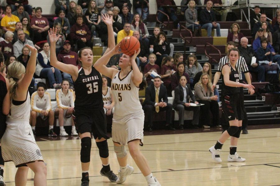 Senior Jaycee Dale attempts a basket at a previous home game. The team is now 13-7 and will play at home on Feb. 27 for Sub-State.