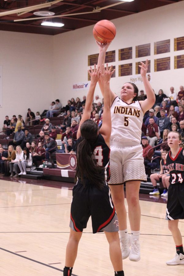 Senior Jaycee Dale attempts a basket at previous game against Great Bend. The Indians are now 12-4 and will play Liberal at home on Feb. 8.