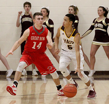 Junior TJ Nunnery  looks past Great Bend defender for a past to the post in a recent match up.