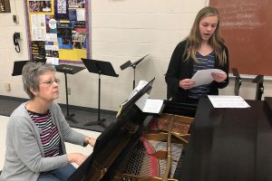 Freshman Samantha Vesper runs through her vocal solos during her lesson after school with accompanist Lexie Robinson.