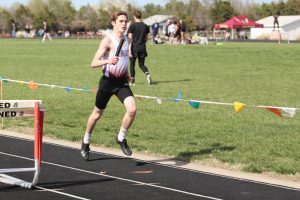 Sophomore Brett Orth competes at a past track meet in Larned.  At WAC, the boys took third and the girls took fourth. 