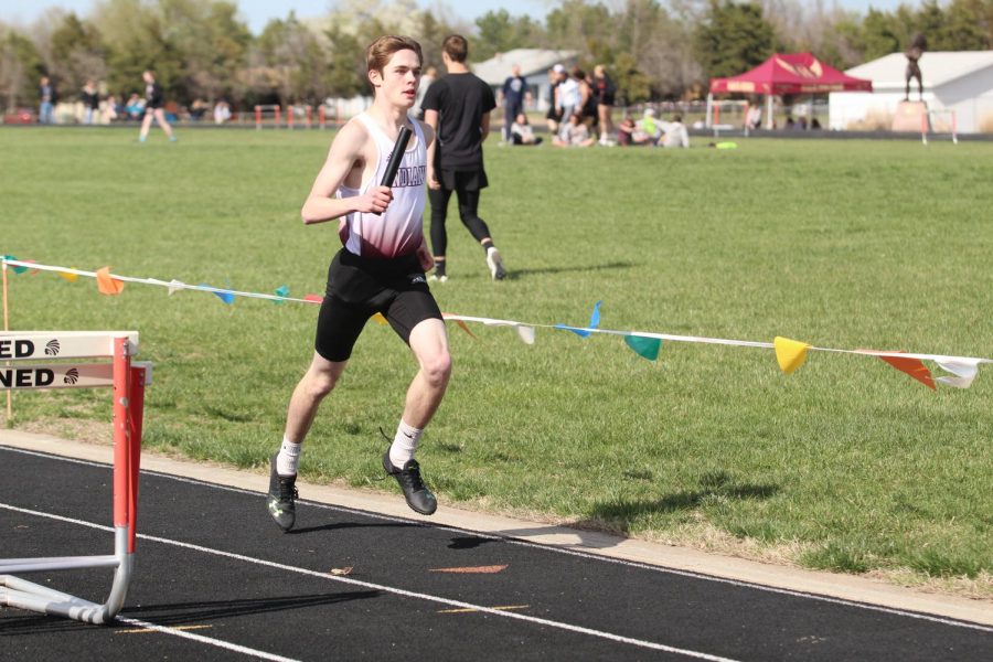 Sophomore Brett Orth competes at a past track meet in Larned.  At WAC, the boys took third and the girls took fourth. 