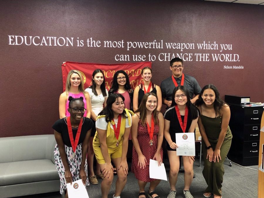 Students inducted into the Foreign Language Honors Society pose for a picture with returning members after the ceremony. Induction took place on Sept. 10 in the library.