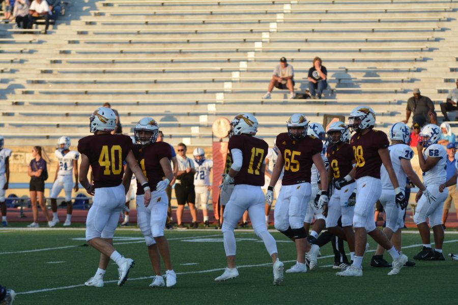 The Indian defense sets up for the next play during their last home game. 