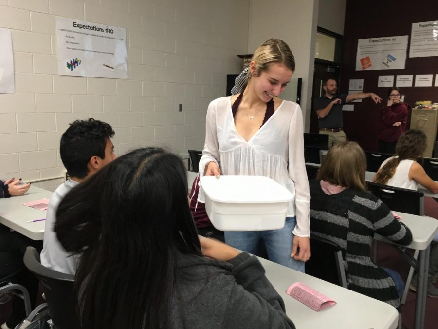 Environment Club co-founder Kassie Zimmer collects votes for Environmental Club president. The elections for vice president, secretary/treasurer and club representatives were elected via email throughout the week following the presidential election.