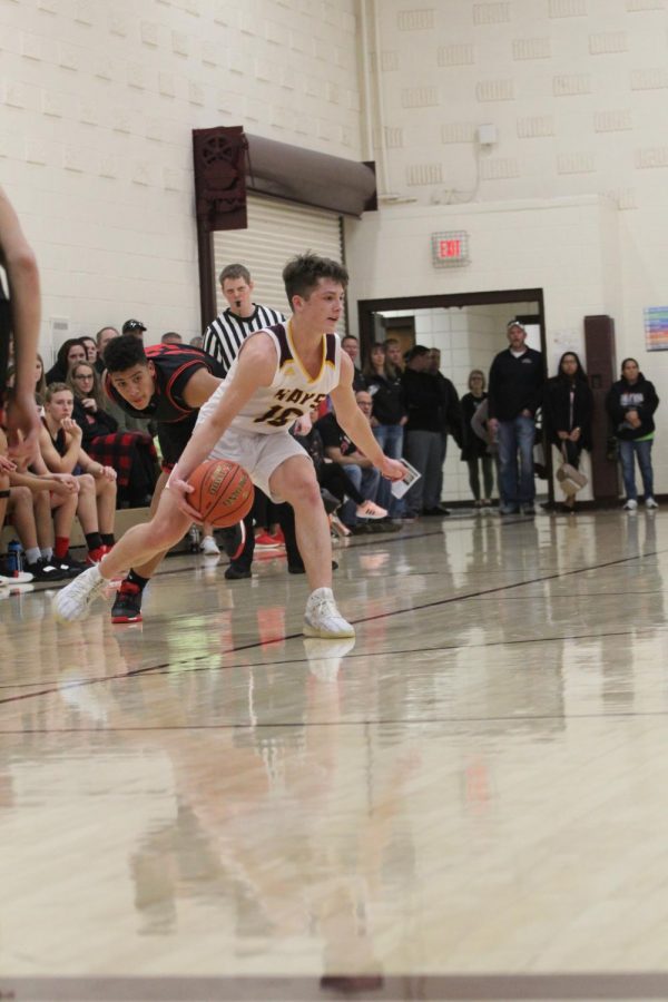Sophomore Noah Weimer dribbles the ball during the home game against Great Bend on Jan. 14. 