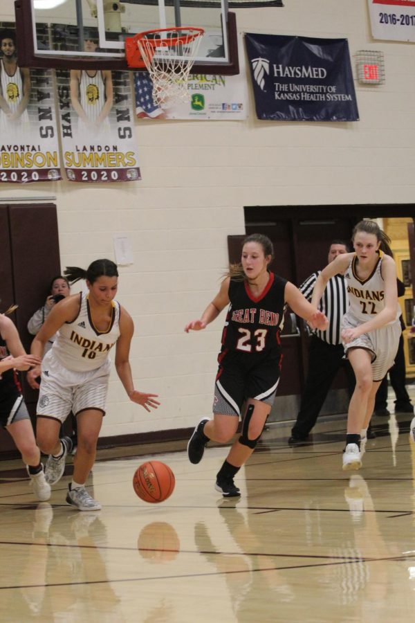 Senior Tasiah Nunnery and sophomore Aleyia Ruder get the ball back from Great Bend during the home game on Jan. 14. 