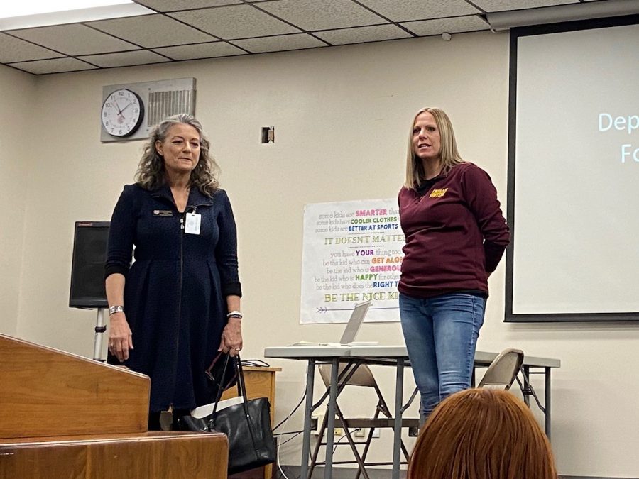 Instructor Jennifer Younger (right) introduces FHSU Art and Design professor Lisa Ganstrom (left) during the Art Club meeting on Feb.4. Ganstrom talked to students about the opportunities for art students at Fort Hays State University and showed pictures of the new art building on campus.
