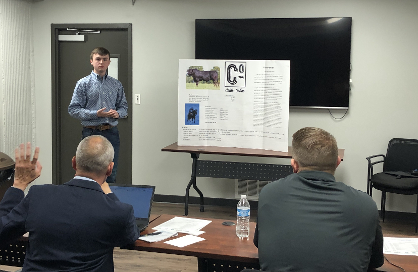 Freshman+Tanner+Werth+presents+his+company+Cattle.Online+to+panel+of+judges+during+the+2020+Ellis+County+Youth+Entrepreneur+Challenge.+Twenty-five+students+competed+in+the+event.