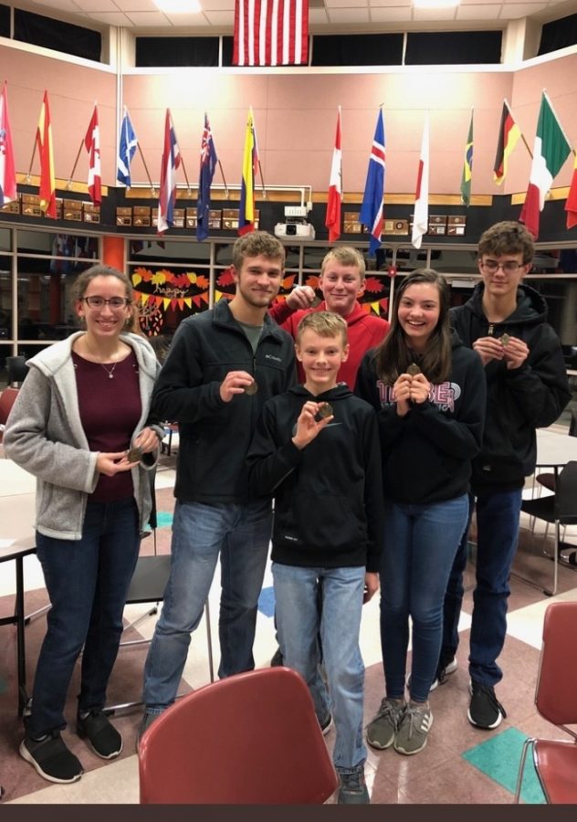 Scholars+Bowl+members+pose+with+their+first+place+medals+after+the+Colby+Invitational+meet+on+Dec.+9%2C+2019.+Meets+this+year+will+mostly+be+held+online+due+to+COVID+concerns.