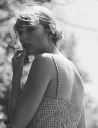 Taylor Swift's latest album "folklore" is indie folk. The photo shoot that accompanied the album release is in all black and white and was shot in a forrest.