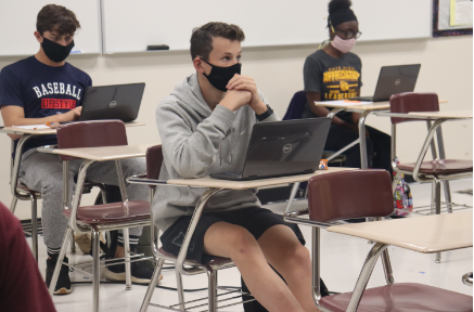 Students in Scholars Bowl practice for upcoming meets