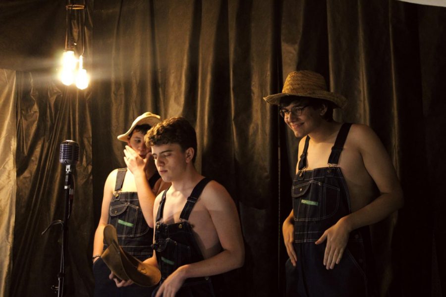 Seniors Gabe McGuire, Tom Drabkin, and Andrew Duke (left to right) line up in their order as the opening act in the 2021 Cabaret. The trio performed Man of Constant Sorrow from O Brother, Where Art Thou, set in rural Mississippi in 1937.
