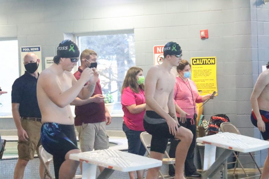 Sophomore Grayson Walburn prepares for a race at the Center for Health Improvement during the Hays swim meet.