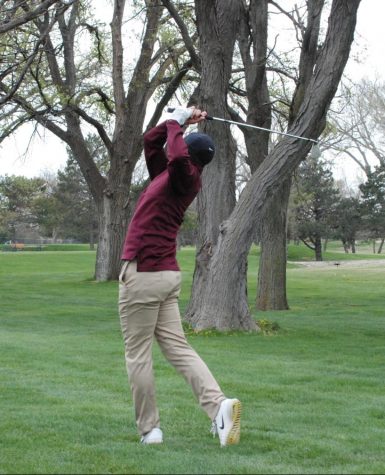Junior Ashton Hernandez hits his nine iron on the 10th hole at the Smoky Hill Invitational tournament in Hays.