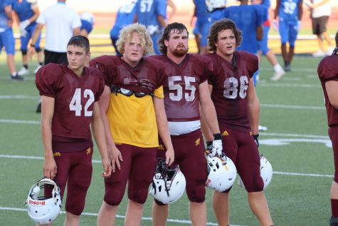 The Indians defensive line stands and observes while the offense is participating in the annual Maroon and Gold Scrimmage and the Jamboree. The defensive line is led by a majority of juniors and seniors. 