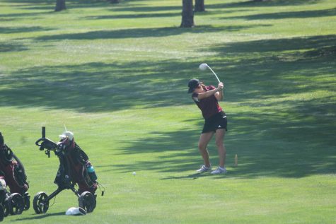 Junior Aspen Melvin hits her tee shot on hole 2 at the HHS golf tournament.