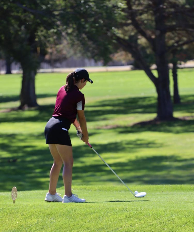 Sophomore+Lily+Garrison+prepares+to+take+her+drive+at+the+TMP+Invitational+Golf+Tournament+at+Smoky+Hill+Country+Club.