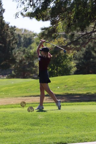 Senior Gracie Wente hit her tee shot at the TMP Invitational Tournament at Smoky Hill Country Club.