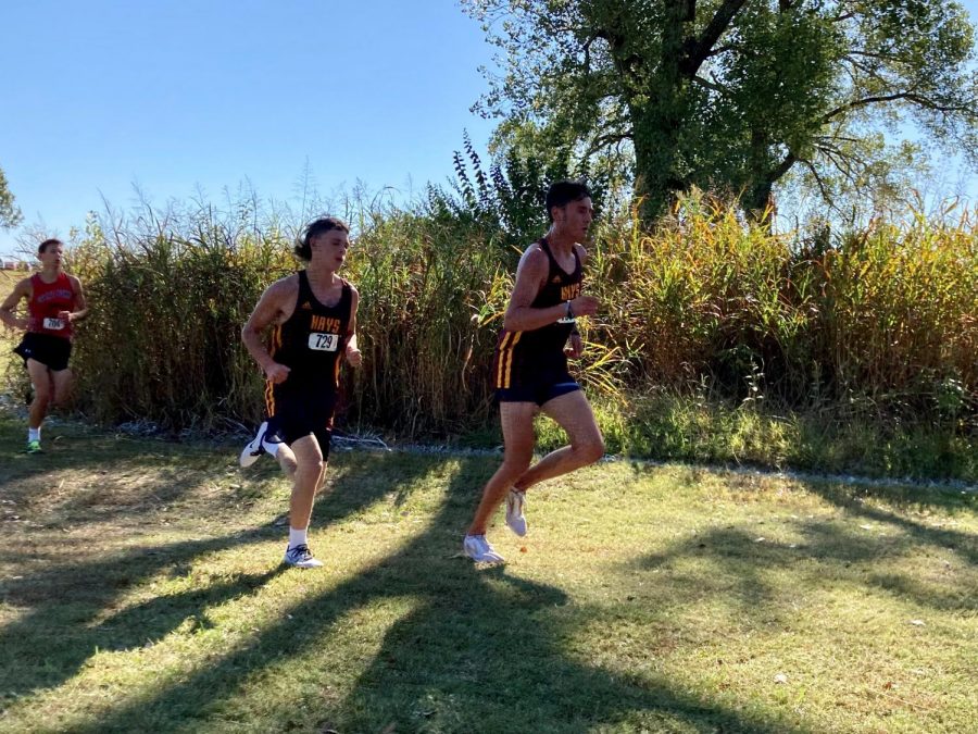 Senior Brayden Hines (left) trails behind senior Landon Viegra (right) at the Allie-T Invitational.